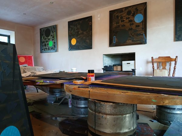 Precision masking tape application for sharp geometric artwork lines