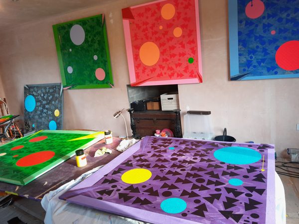 Acrylic color mixing for geometric art composition in studio