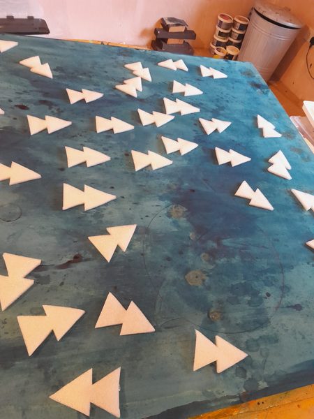 Studio gallery view featuring completed physical geometric paintings